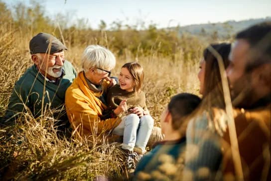 Image - Three generations of family in a field