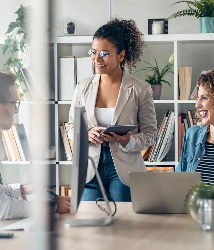 Business woman smiling, leading a meeting