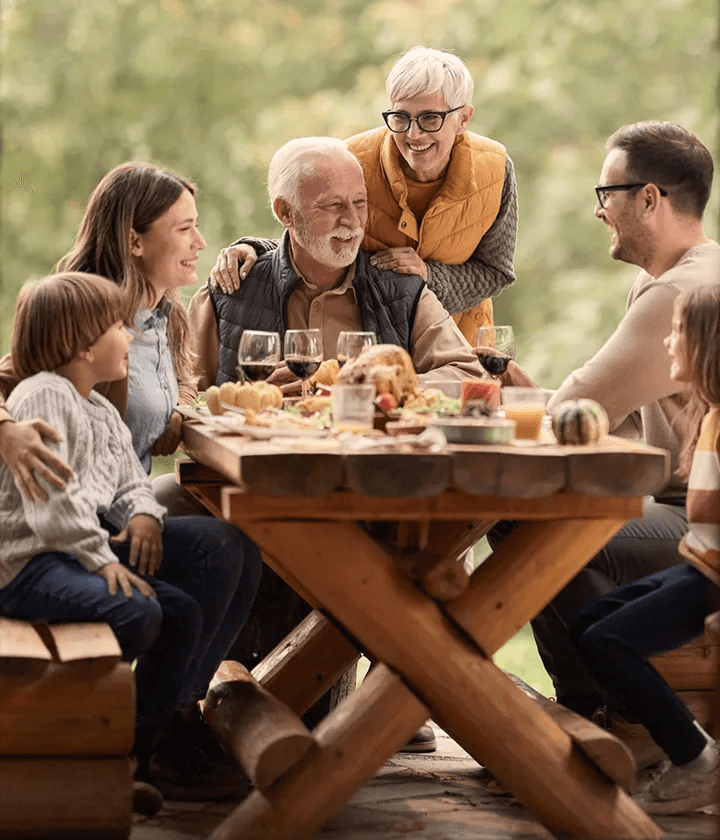Multi-generational family, eating outside