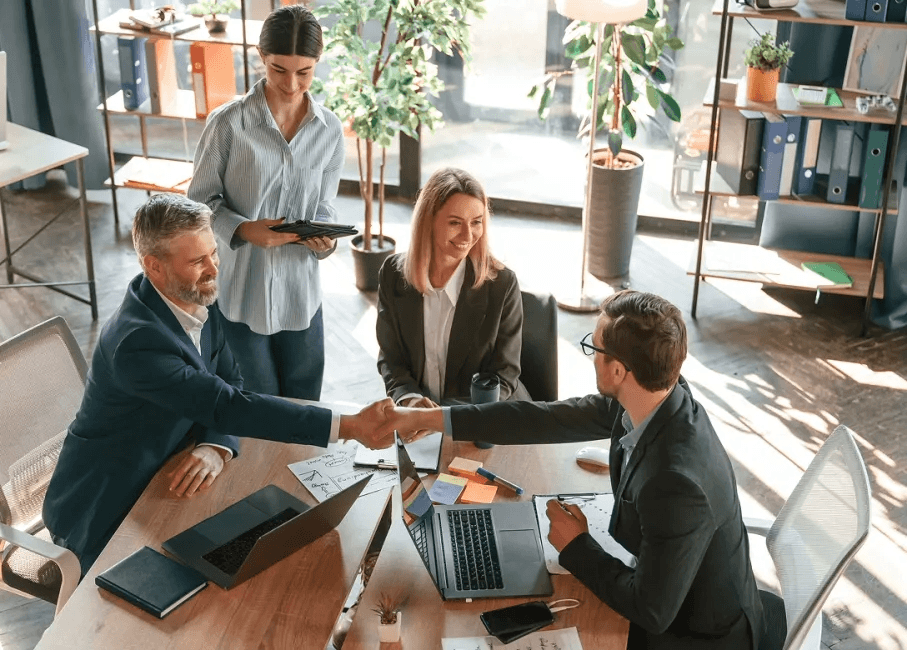 Image - Group business meeting handshake