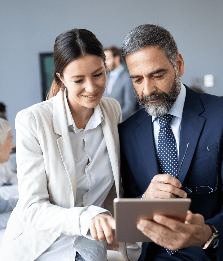 Business people checking tablet