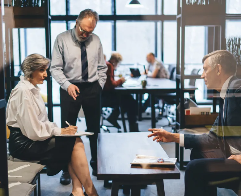 Experienced office people discussing