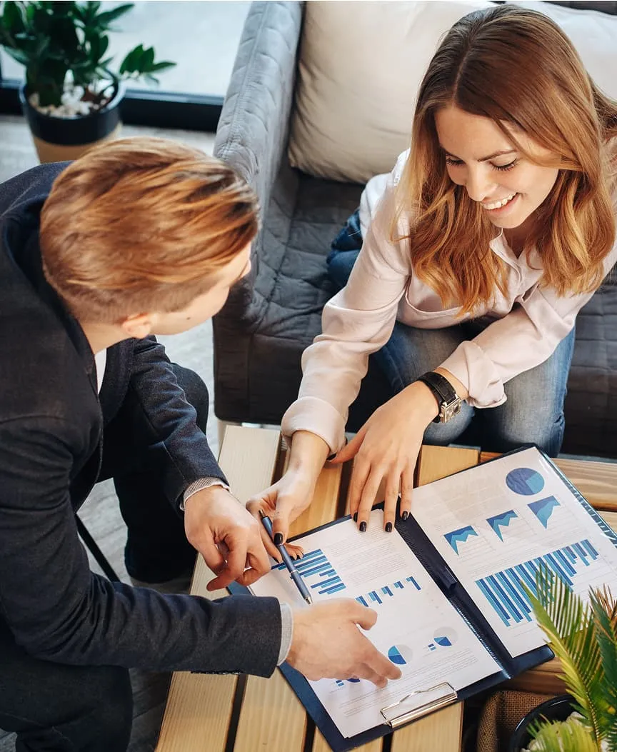 Man and woman looking at charts