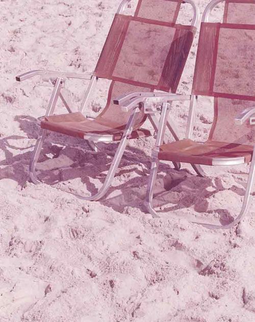 Image of two chairs on pink background