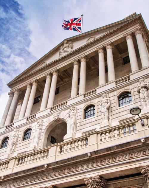 Government building with Union Jack flag at top underneath a blue sky