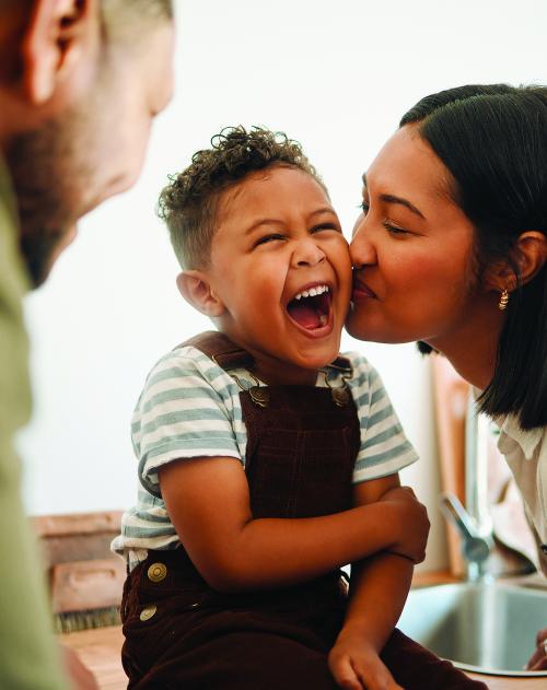 Family image of young child with mother and father