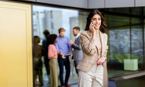 A business woman outside on the phone