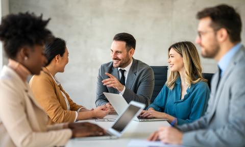 A group of office workers working around a table